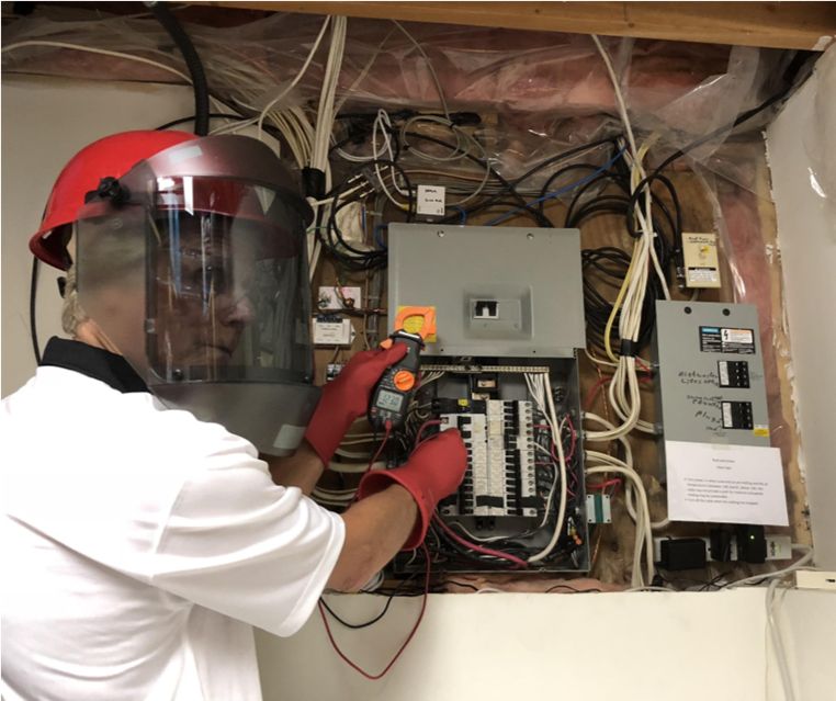 man-working-with-electric-board Inspection of electric cables