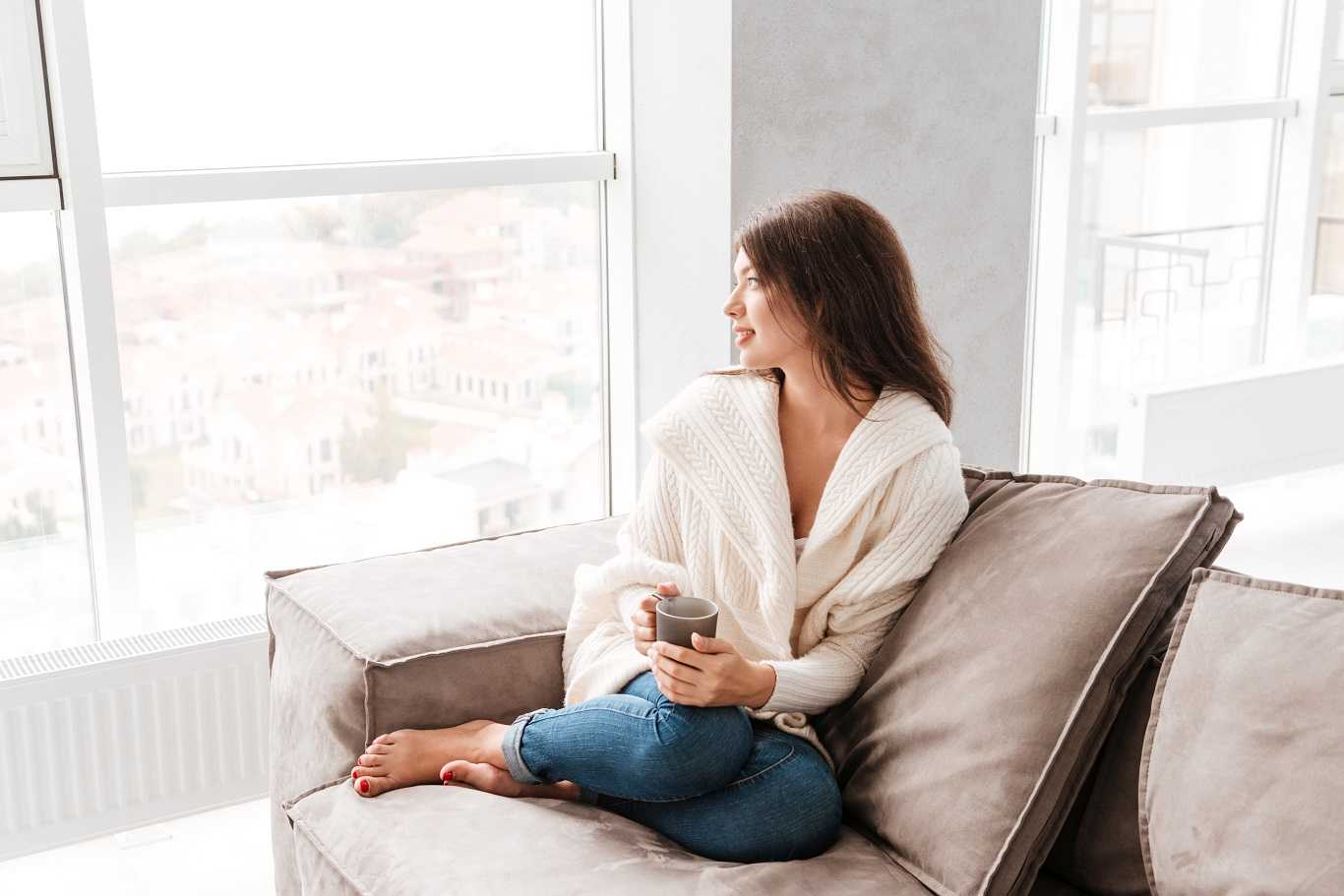 woman-with-cup-of-coffee Girl sitting on couch